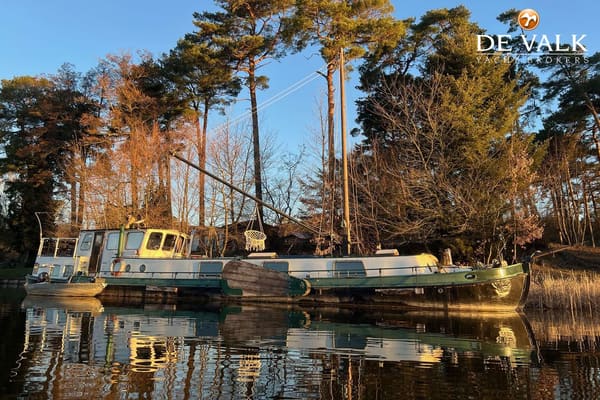 Luxe motor Tjalk 1911 – historisch stalen woonschip met wellness